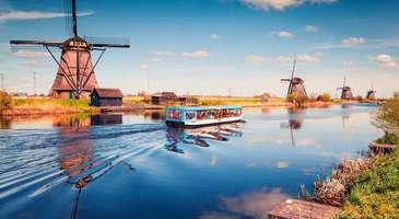 Kinderdijk Yel Değirmenleri'nde güneşin batışını seyredin